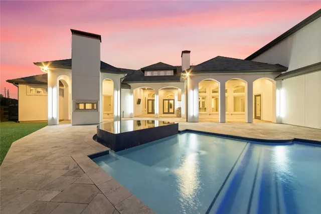 a front view of a house with swimming pool