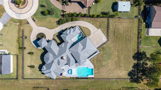 an aerial view of a house with swimming pool
