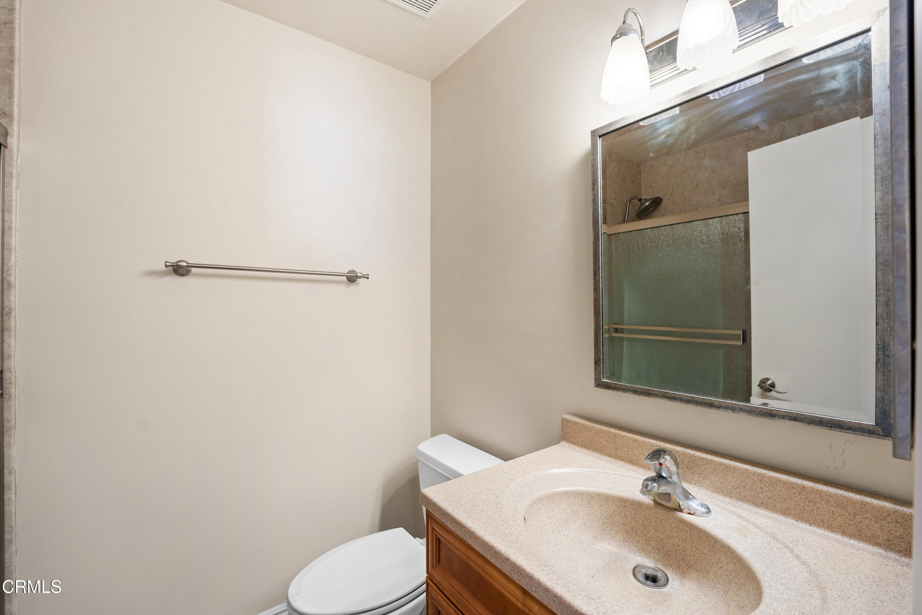 500 Holly Avenue Oxnard, CA 93036 - Photo 19 of 33 a bathroom with a sink toilet and mirror
