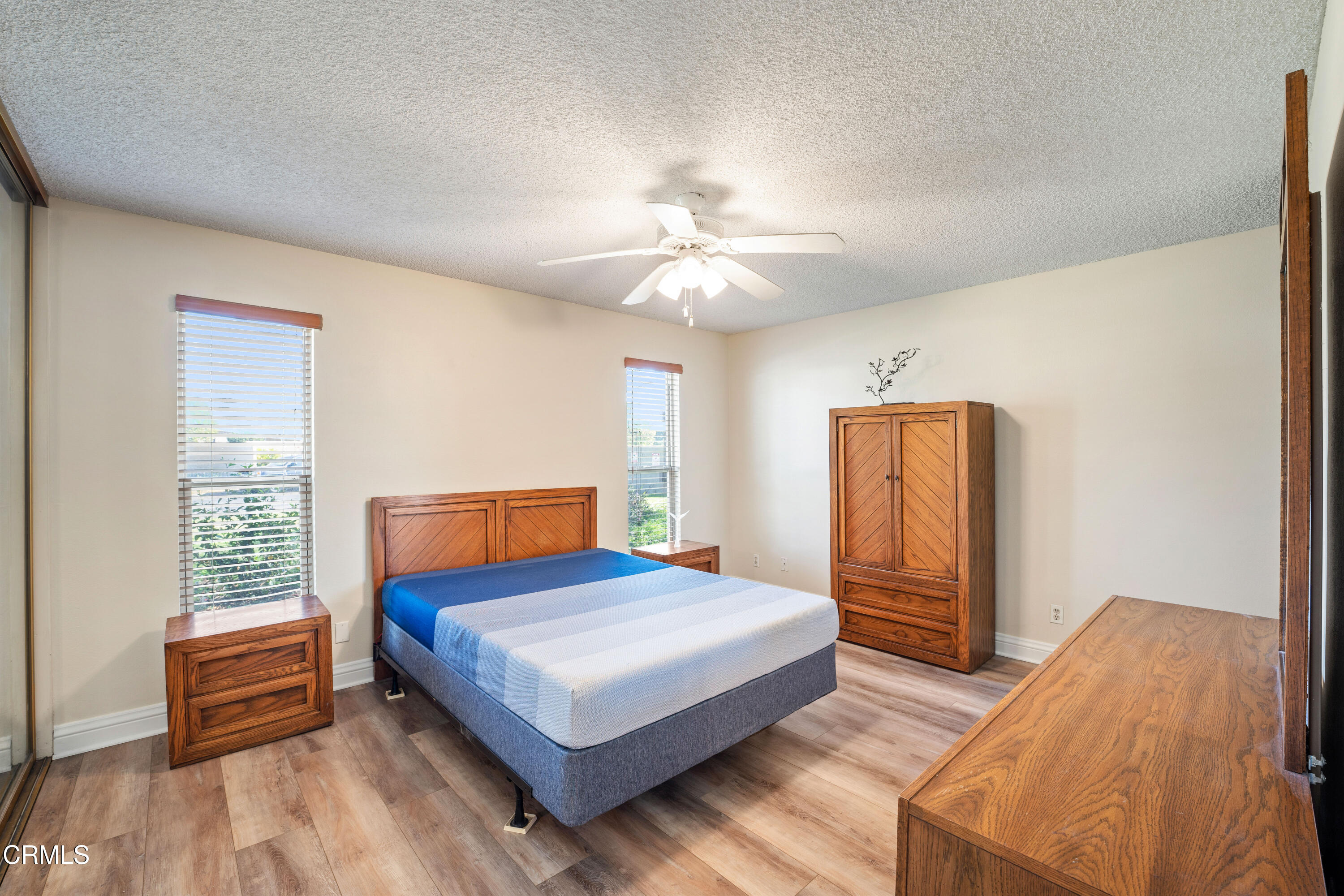 500 Holly Avenue Oxnard, CA 93036 - Photo 20 of 33 a bedroom with furniture and wooden floor