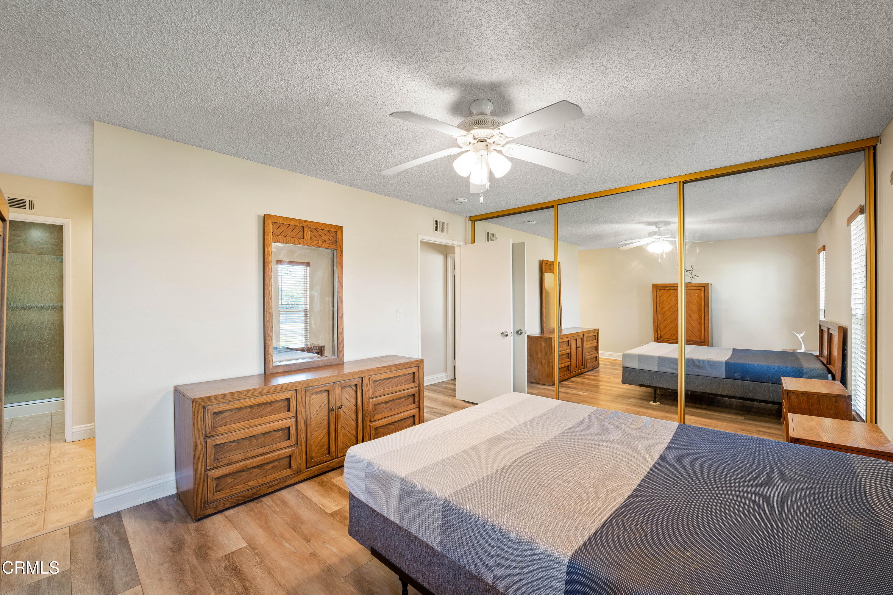 500 Holly Avenue Oxnard, CA 93036 - Photo 21 of 33 a bedroom with a bed and wooden furniture