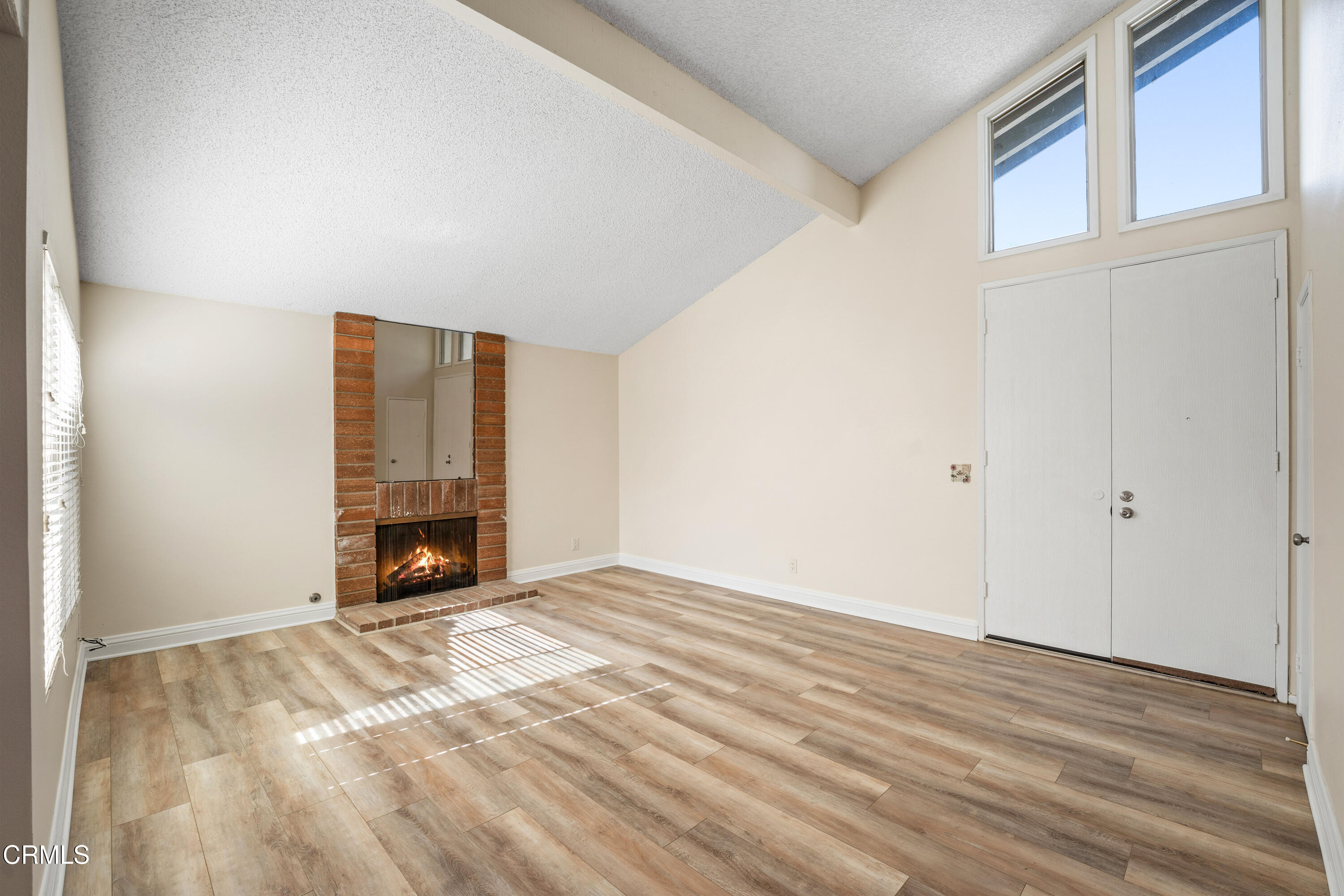 500 Holly Avenue Oxnard, CA 93036 - Photo 4 of 33 a view of an empty room with wooden floor and a window
