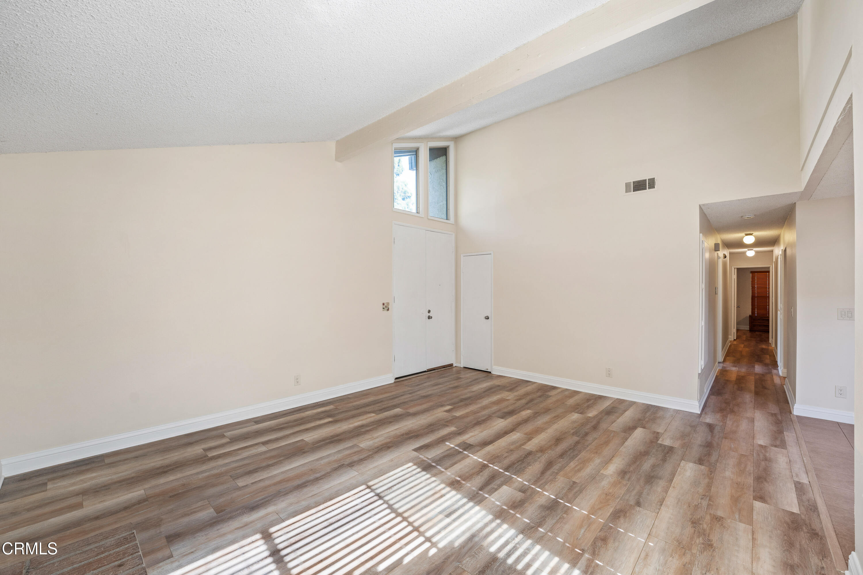 500 Holly Avenue Oxnard, CA 93036 - Photo 6 of 33 a view of an empty room and wooden floor