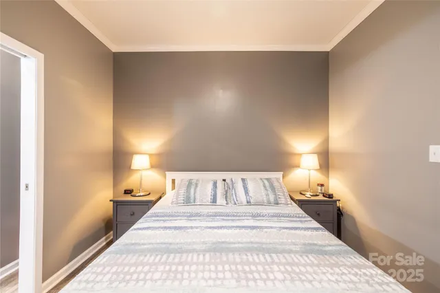 a bedroom with a bed and a mirror