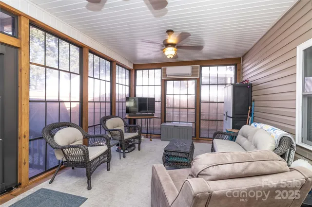 a view of a dining room with furniture and a window