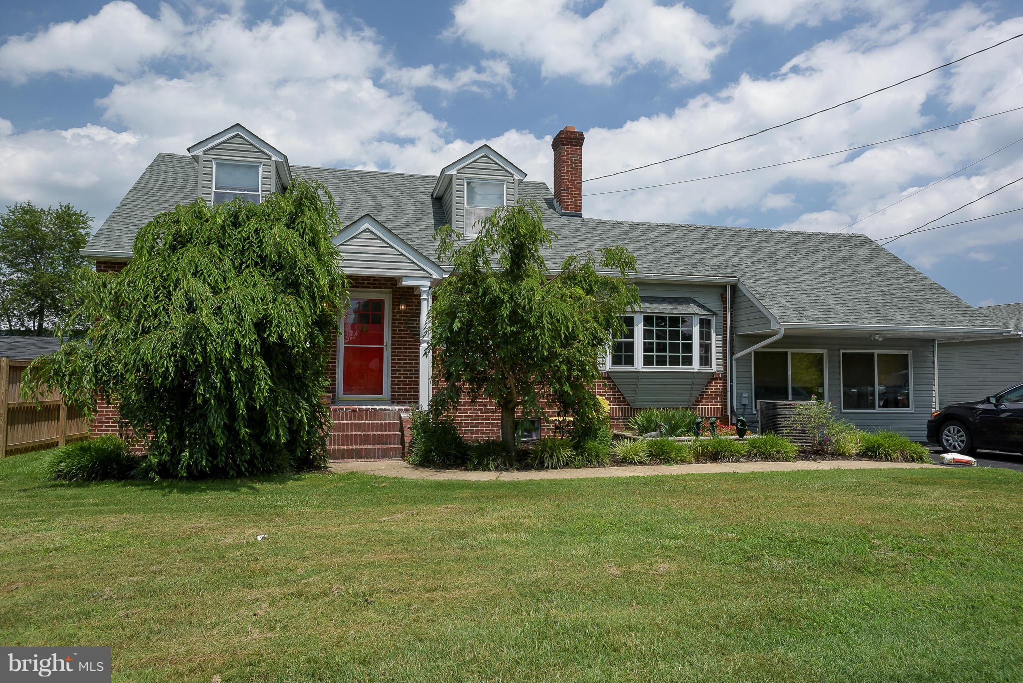 636 Deale Road Deale, MD 20751 - Photo 1 of 30 a front view of a house with a garden