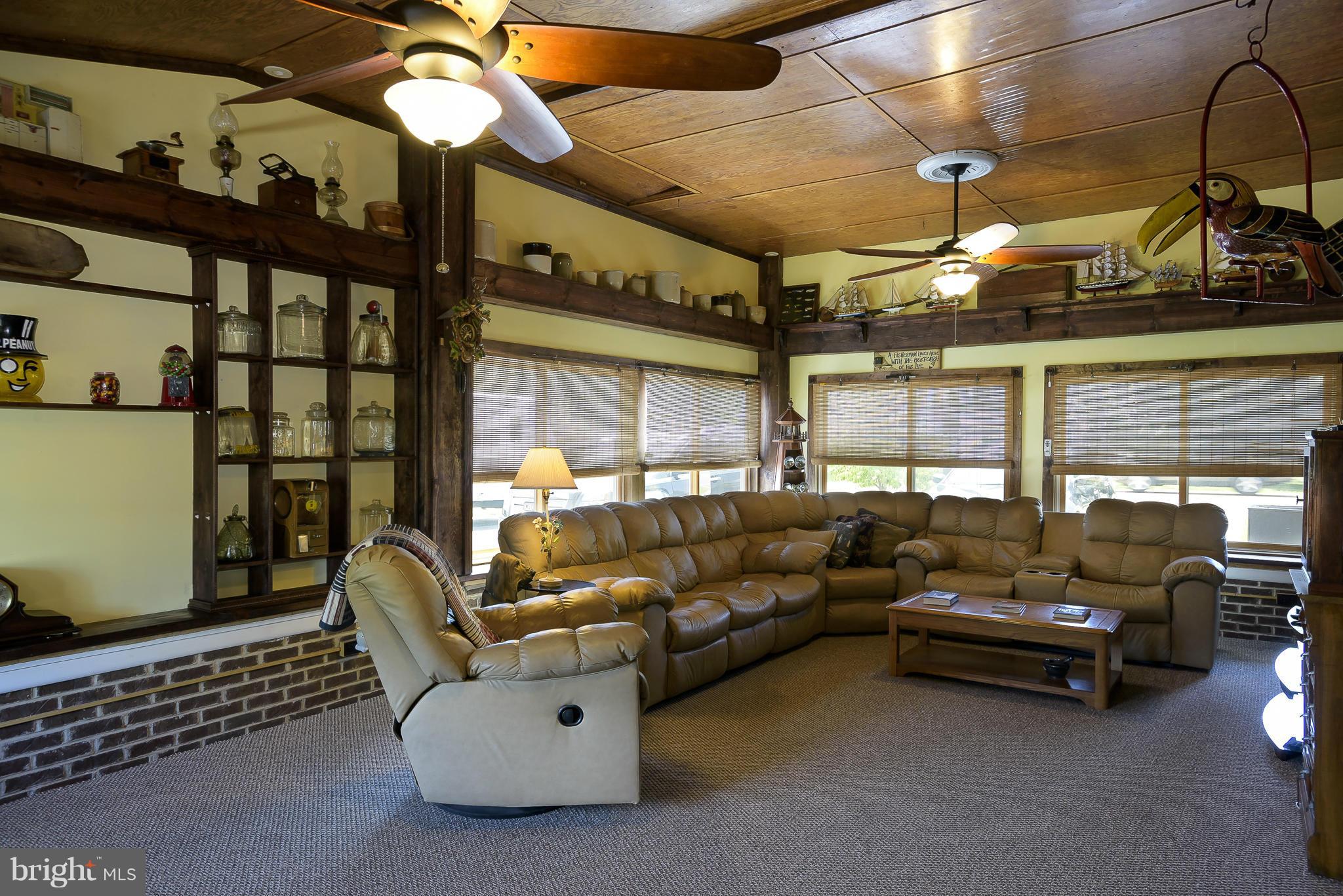 636 Deale Road Deale, MD 20751 - Photo 11 of 30 a living room with furniture and a chandelier