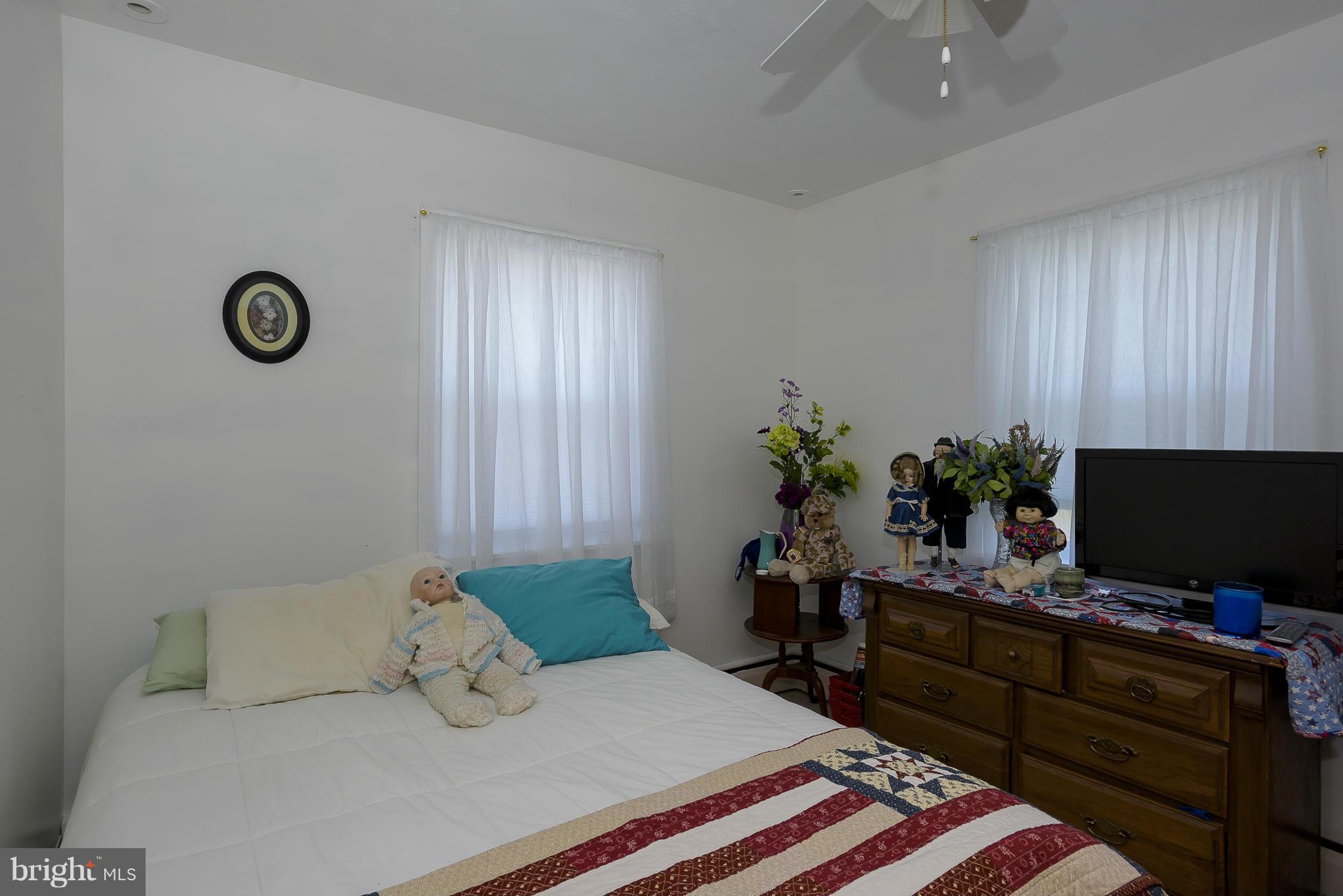 636 Deale Road Deale, MD 20751 - Photo 14 of 30 a bedroom with a bed and a flat screen tv
