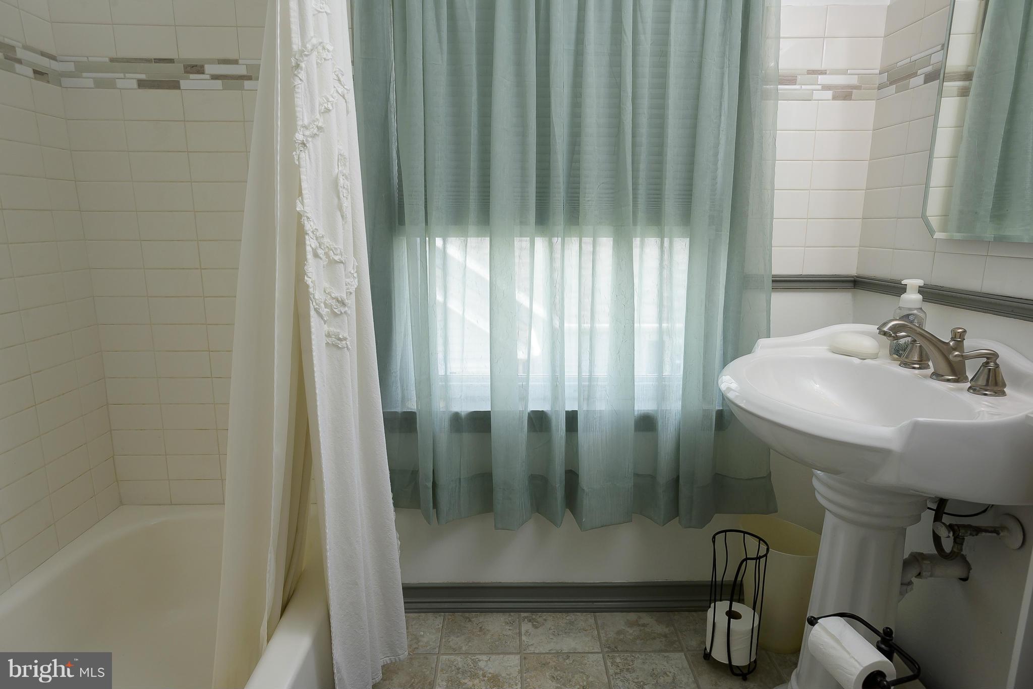 636 Deale Road Deale, MD 20751 - Photo 17 of 30 a bathroom with a shower and a sink