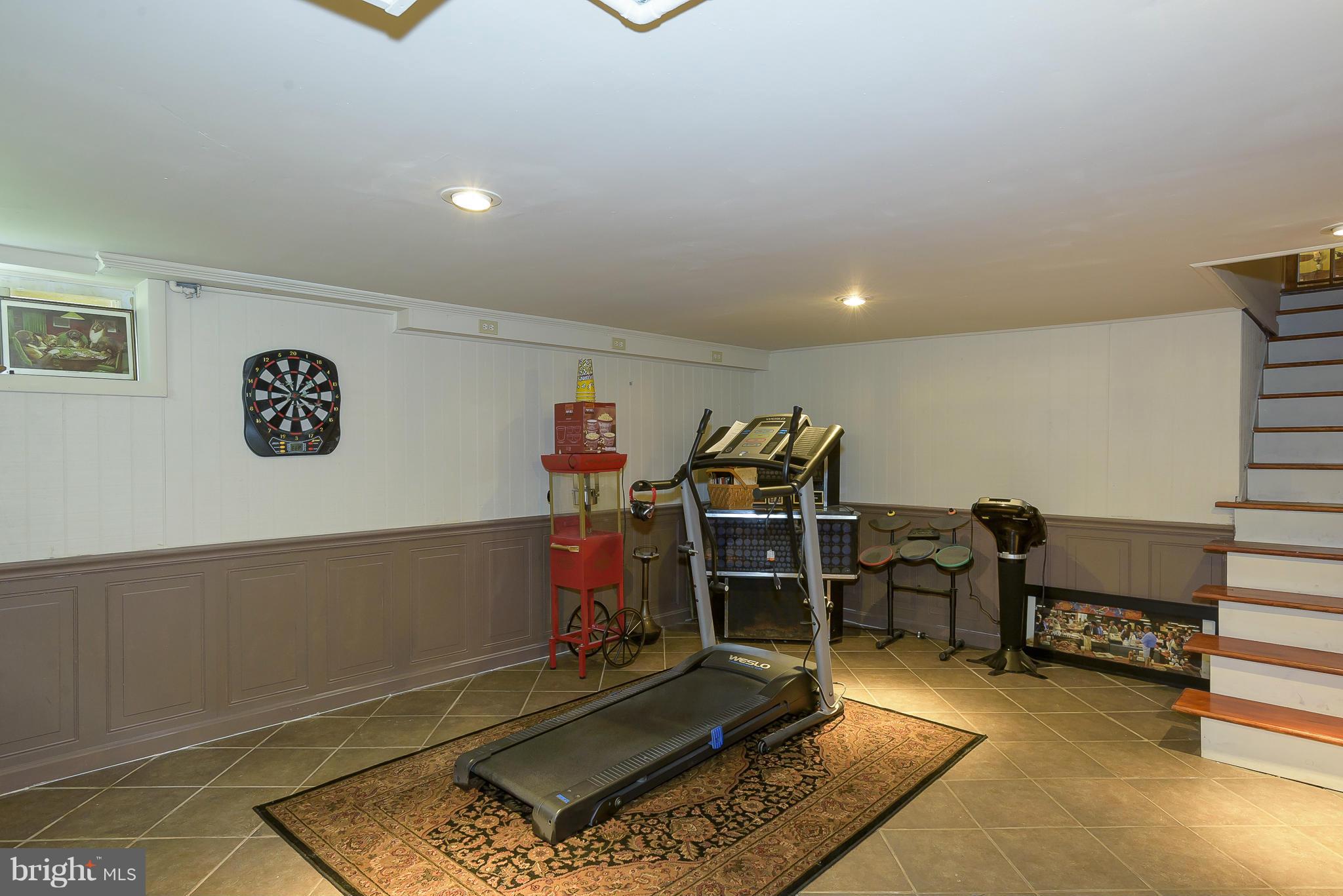636 Deale Road Deale, MD 20751 - Photo 20 of 30 a room with gym equipment and a rug