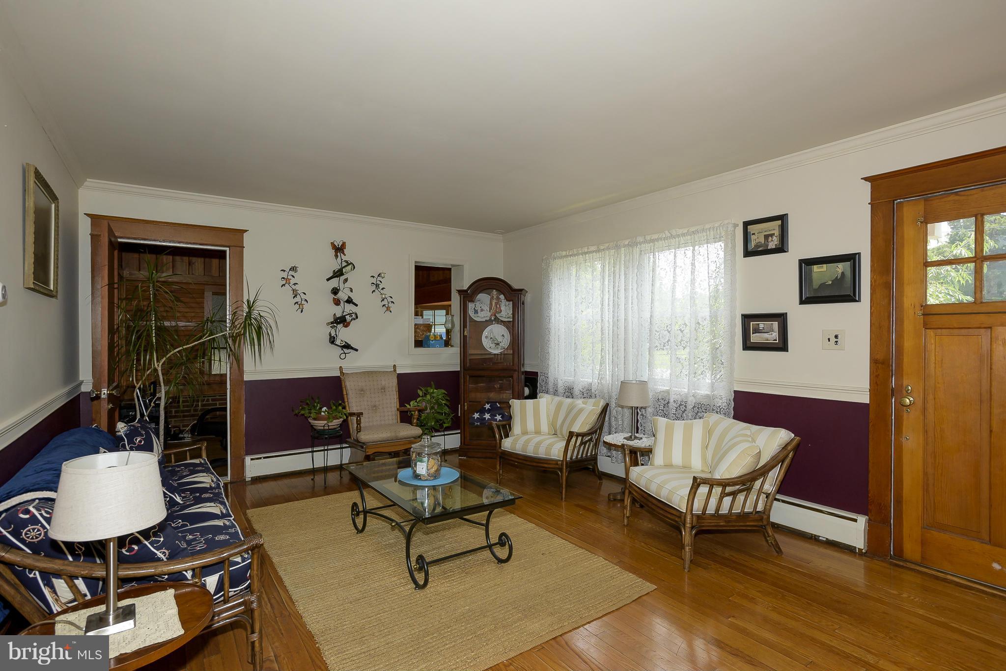 636 Deale Road Deale, MD 20751 - Photo 3 of 30 a living room with fireplace furniture and a table