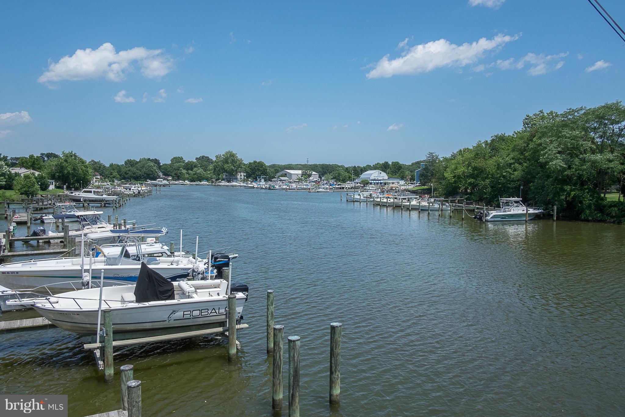 636 Deale Road Deale, MD 20751 - Photo 28 of 30 a view of a lake with lawn chairs
