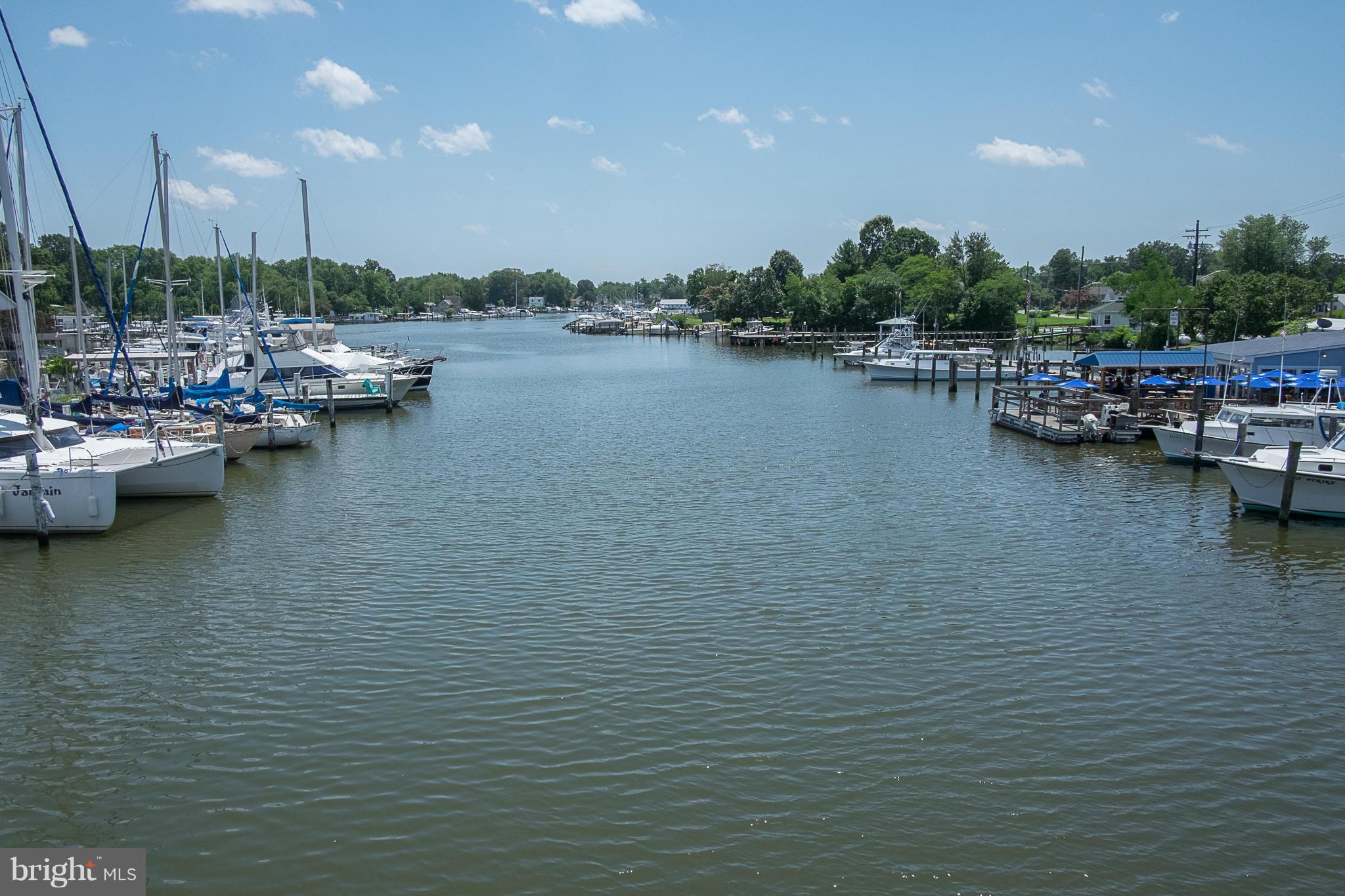 636 Deale Road Deale, MD 20751 - Photo 30 of 30 a view of water with boats and trees in the background