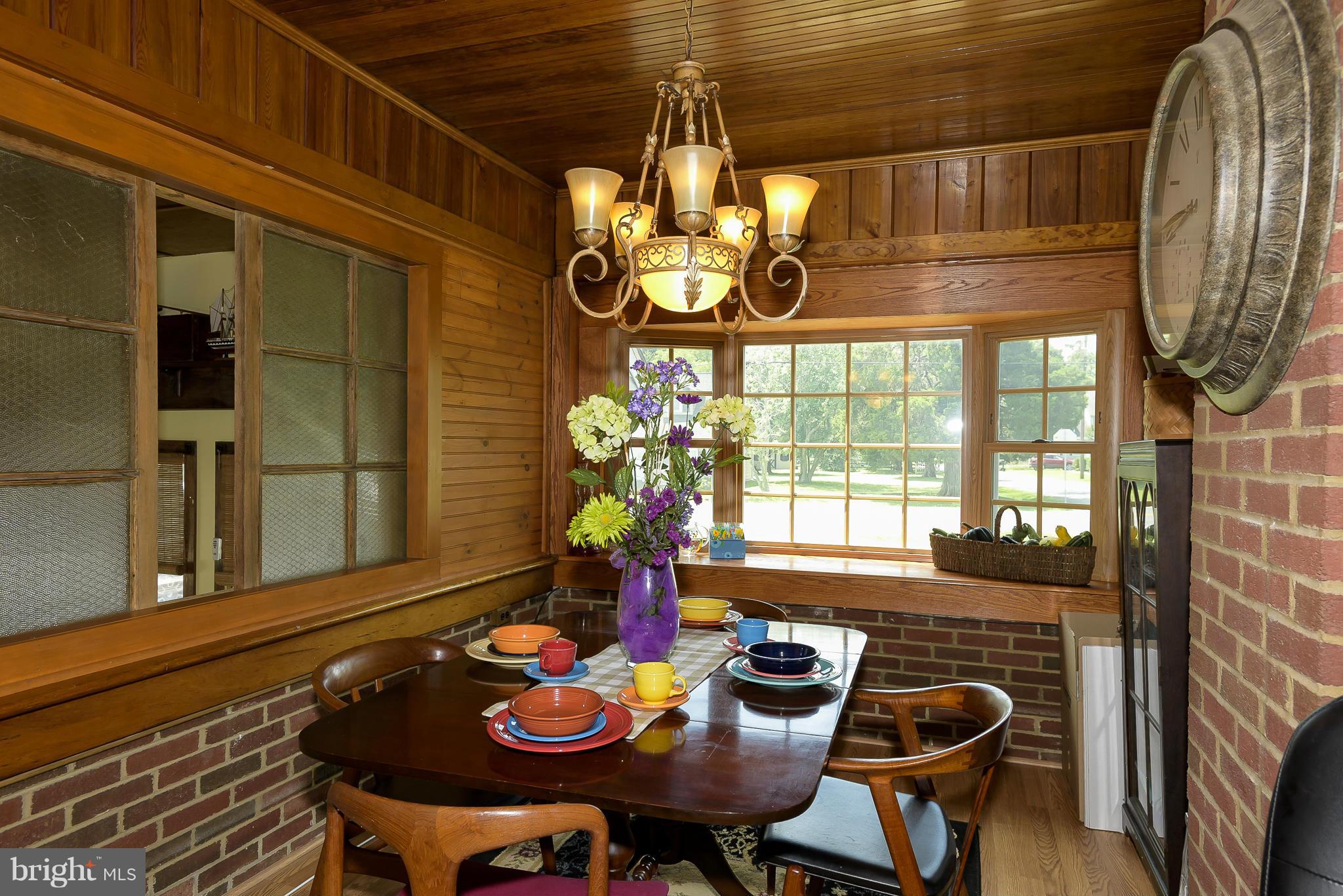 636 Deale Road Deale, MD 20751 - Photo 6 of 30 a view of a dining room with furniture a chandelier and wooden floor