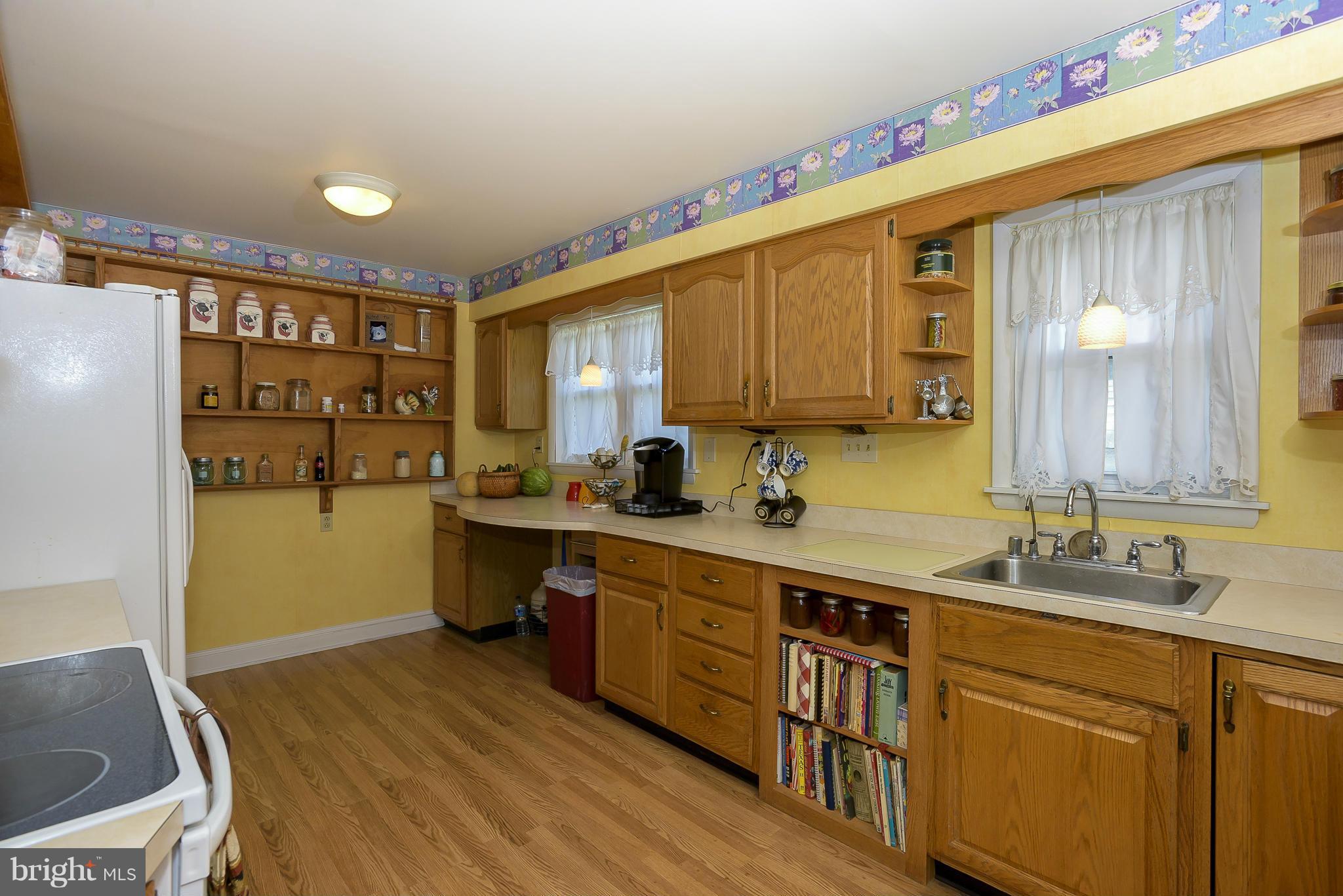 636 Deale Road Deale, MD 20751 - Photo 7 of 30 a kitchen with a sink cabinets and wooden floor