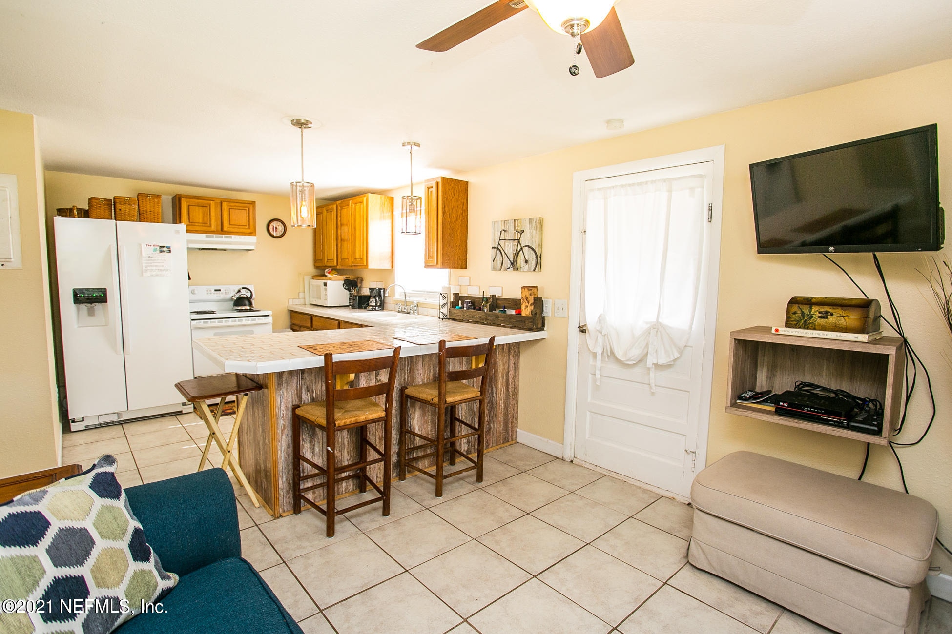210 Palmetto Road St. Augustine, FL 32080 - Photo 12 of 16 a kitchen with stainless steel appliances a stove a sink and a refrigerator
