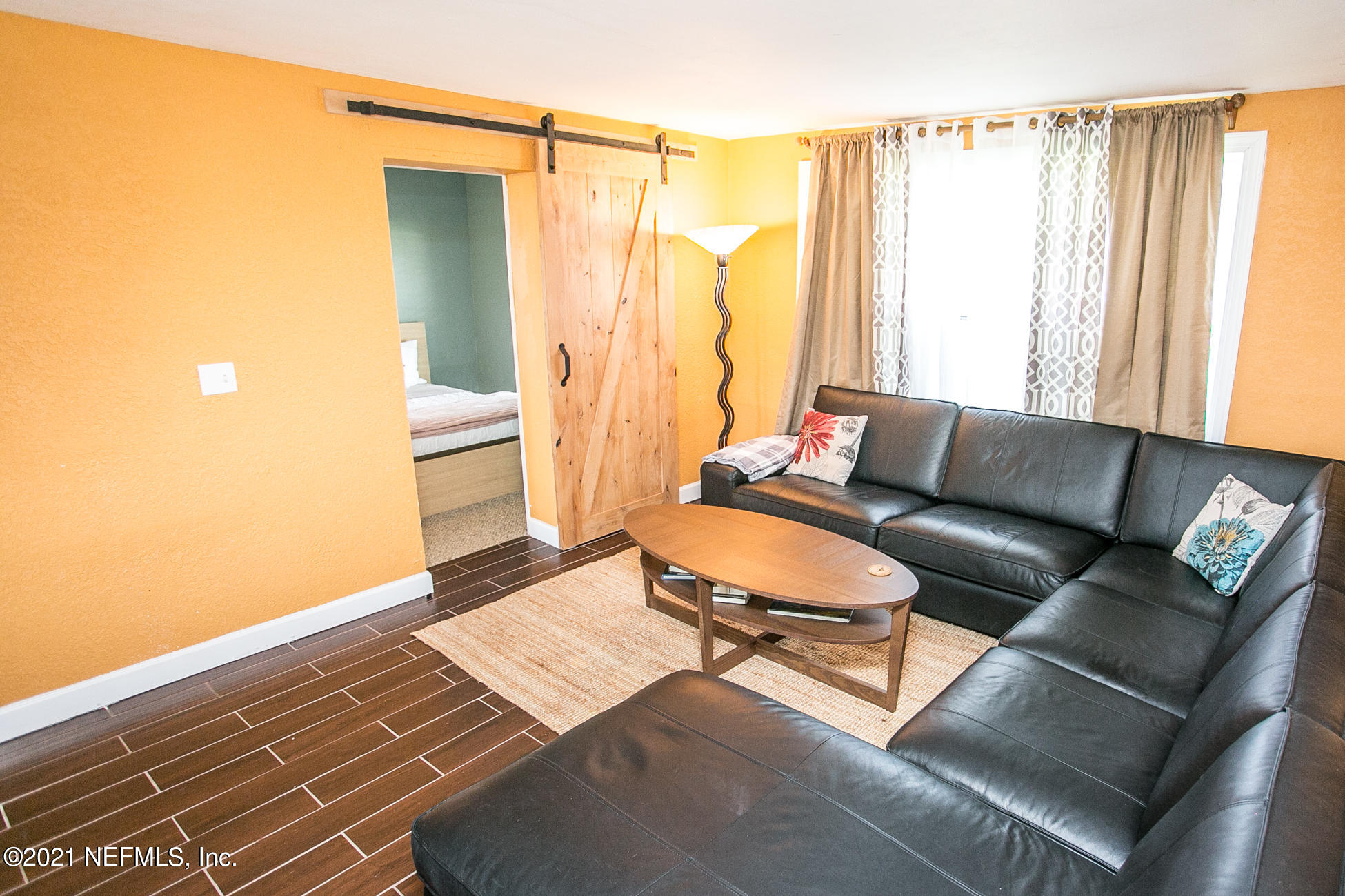 210 Palmetto Road St. Augustine, FL 32080 - Photo 5 of 16 a living room with furniture and a rug