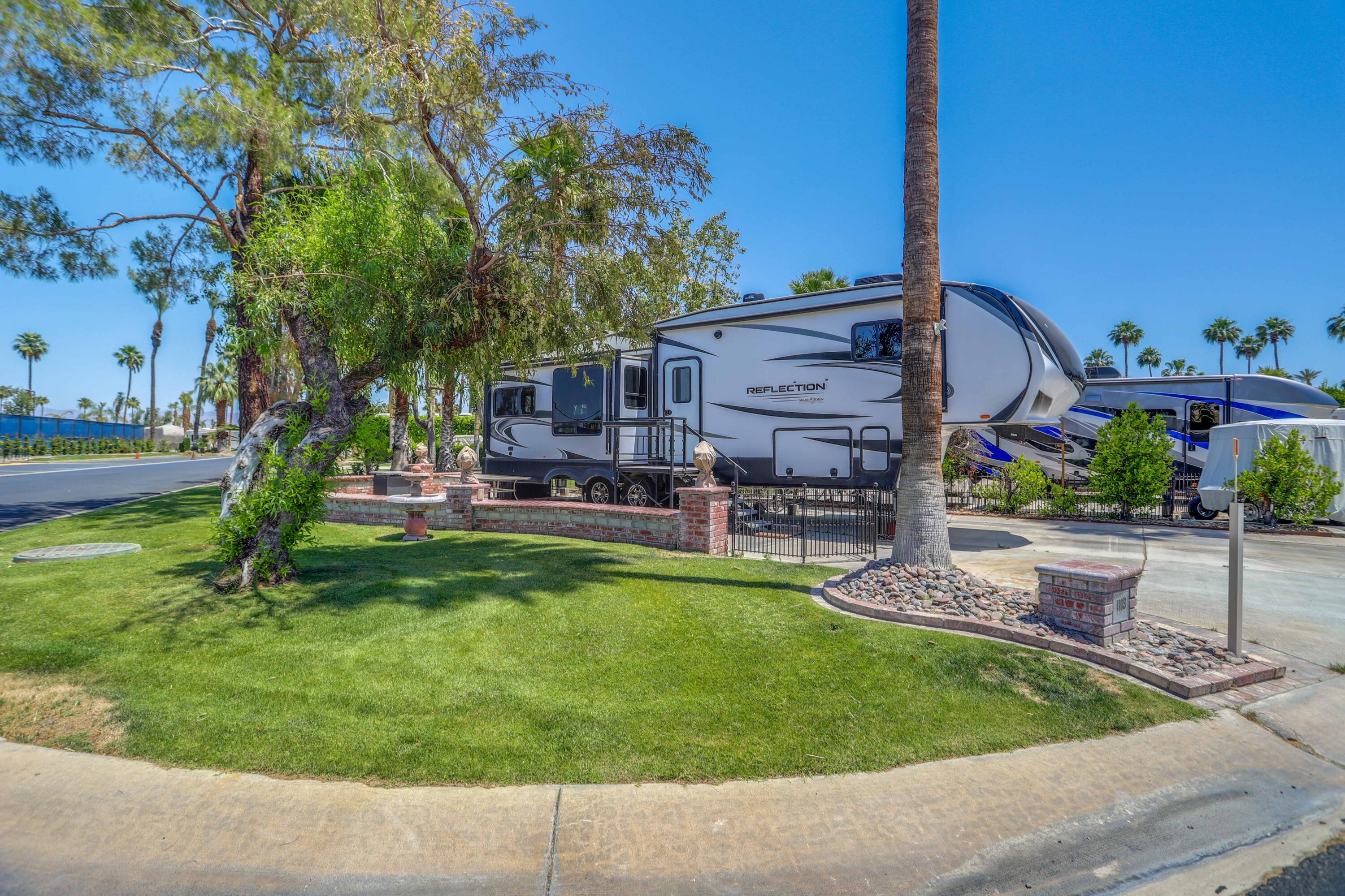 a house view with a sitting space and garden space