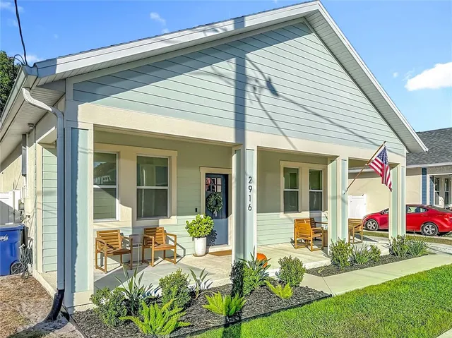 a front view of house with yard and porch