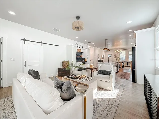 a view of a bedroom with workspace and window