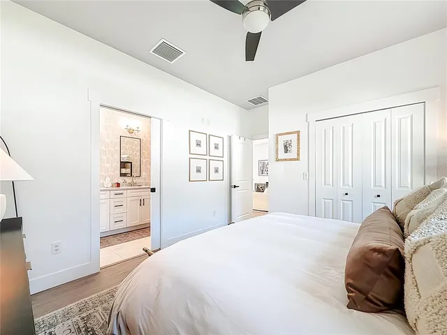 a bathroom with a double vanity sink mirror and shower