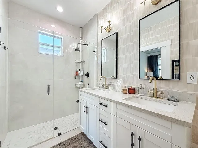 a view of a patio with table and chairs with wooden floor and fence
