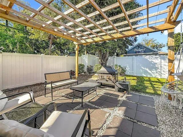 a front view of a house with a yard and table and chairs