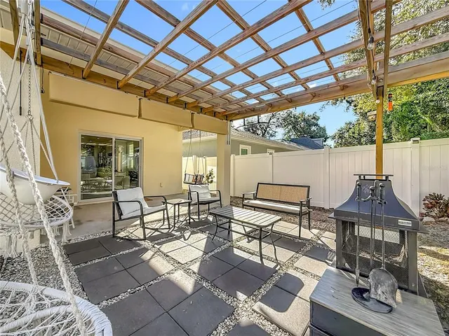a view of a backyard with sitting area