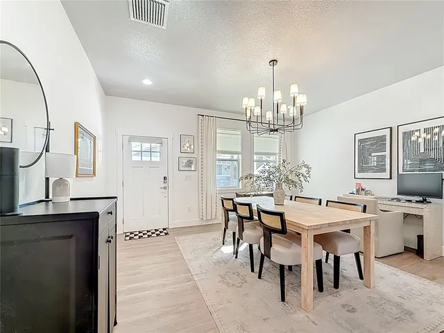 a kitchen with a sink a stove and cabinets