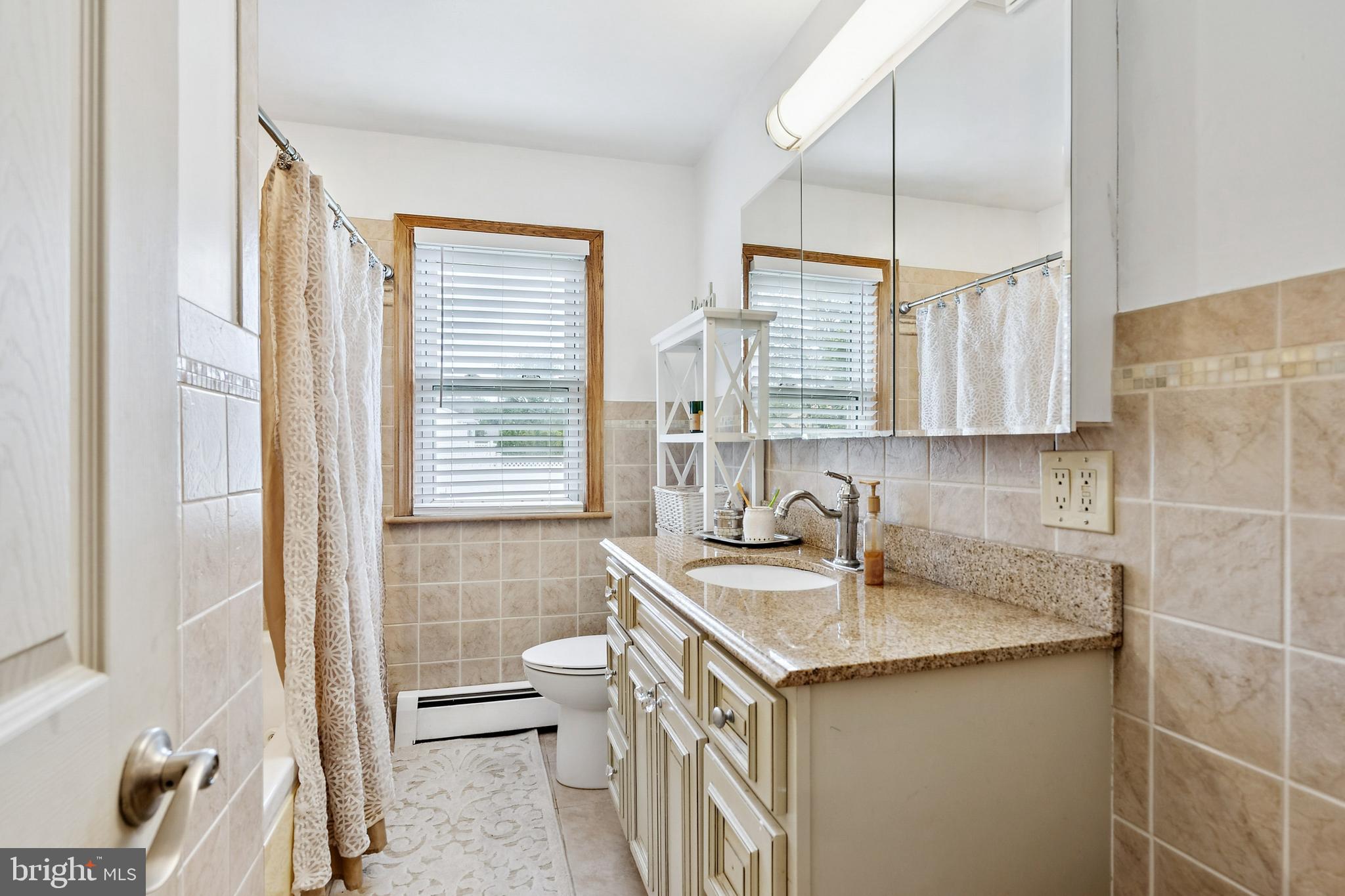 520 Rutgers Avenue Burlington, NJ 08016 - Photo 16 of 29 a kitchen with a sink stove and cabinets