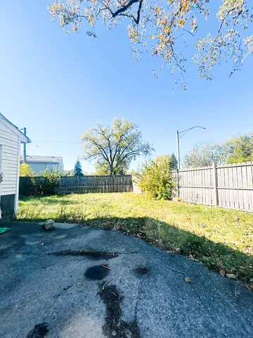a view of swimming pool with a yard