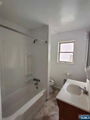 a bathroom with a sink toilet and bathtub