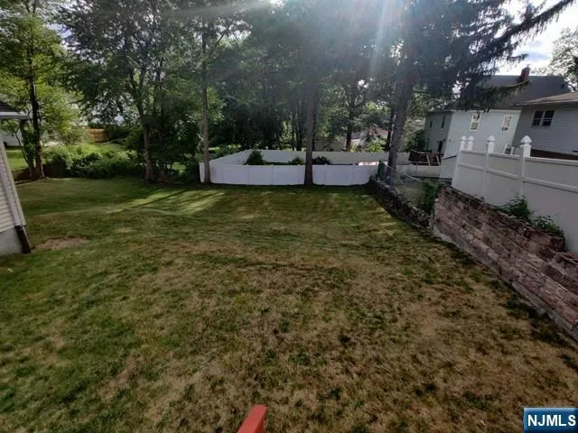 a view of a backyard with sitting area