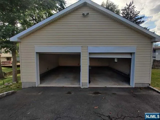 a front view of a house with garage