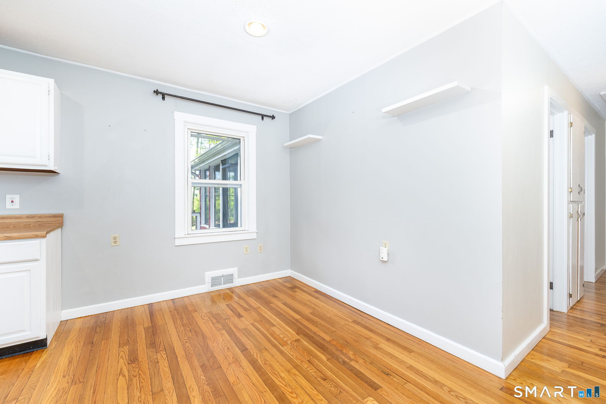 347 Griffin Road Suffield, CT 06093 - Photo 8 of 35 a view of empty room with wooden floor and fan