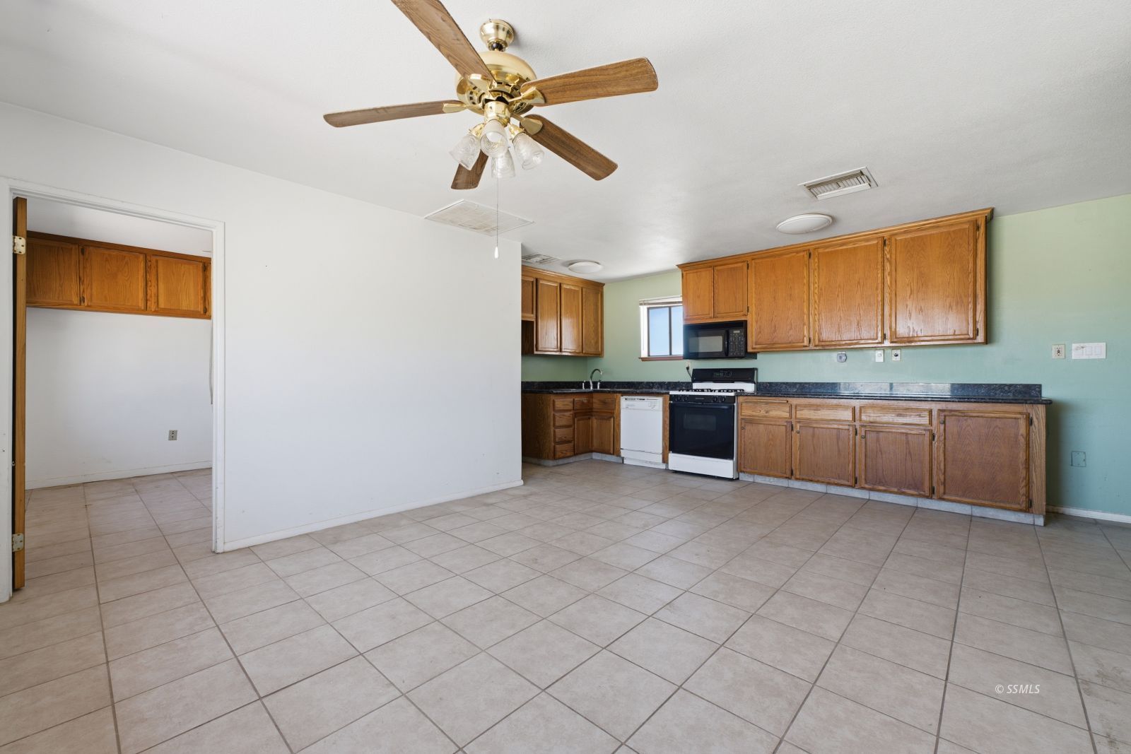 3443 3rd Street Inyokern, CA 93527 - Photo 6 of 24 a large kitchen with cabinets and stainless steel appliances