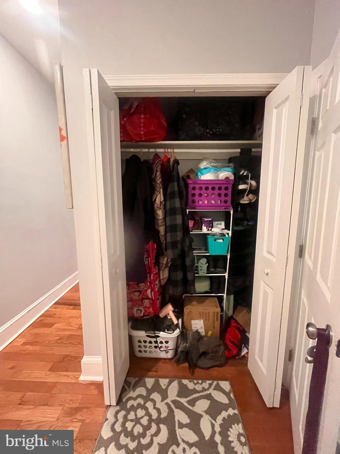 5028 Walnut Street, Unit 1F Philadelphia, PA 19139 - Photo 23 of 32 a view of a hallway with wine and closet