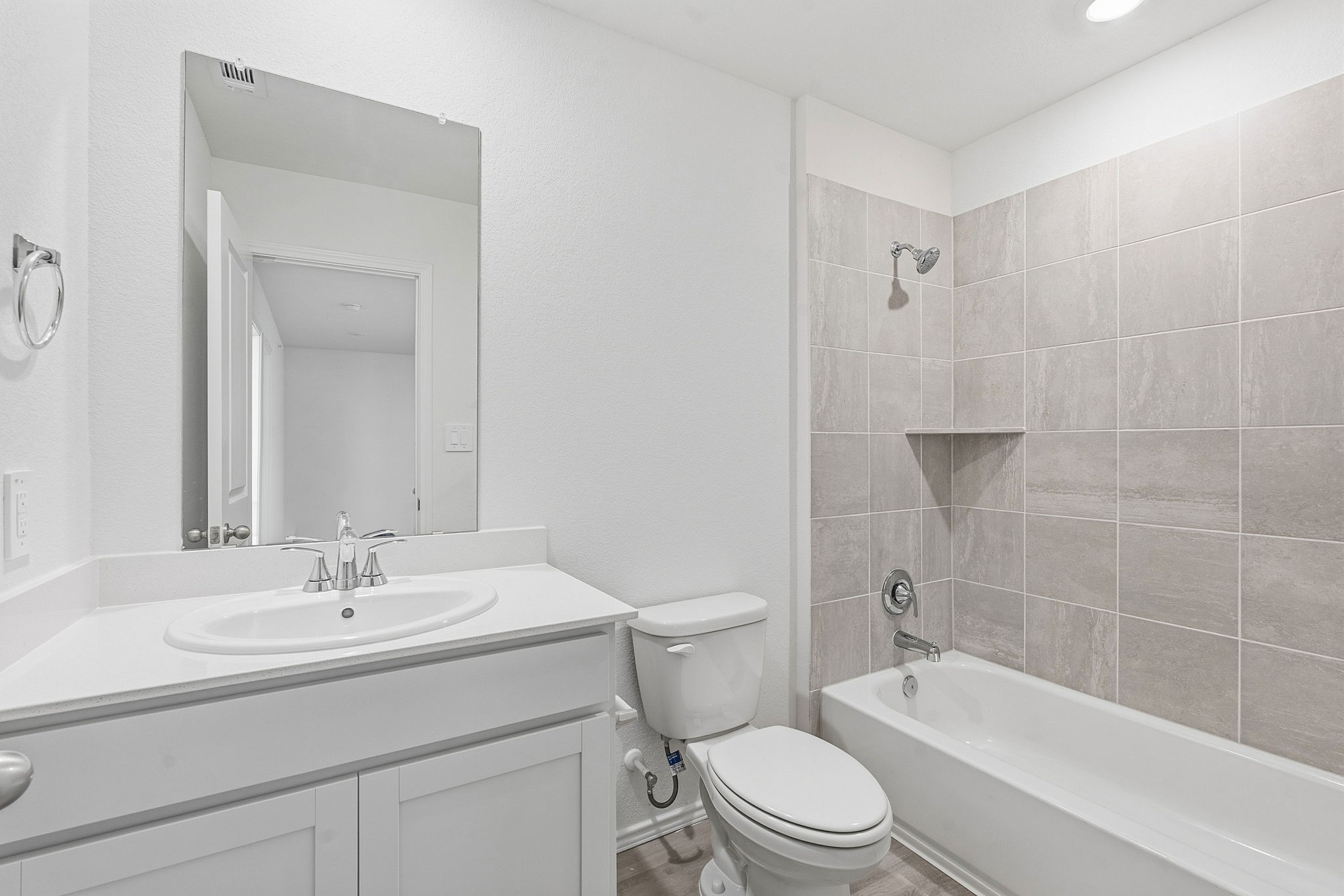 164 Cinnabar Lane, Unit 5 Kyle, TX 78640 - Photo 17 of 21 Bathroom featuring a white vanity with a rectangular sink, a polished chrome faucet, and a large mirror