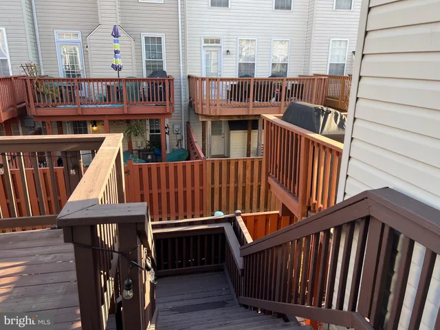 a view of deck with patio outdoor seating and wooden floor