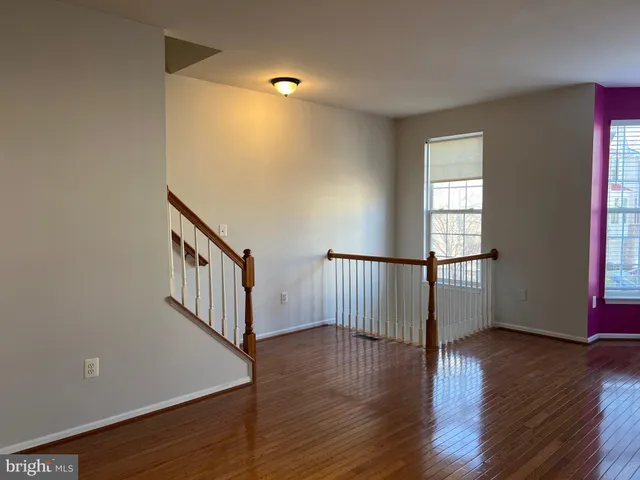 a view of entryway with wooden floor