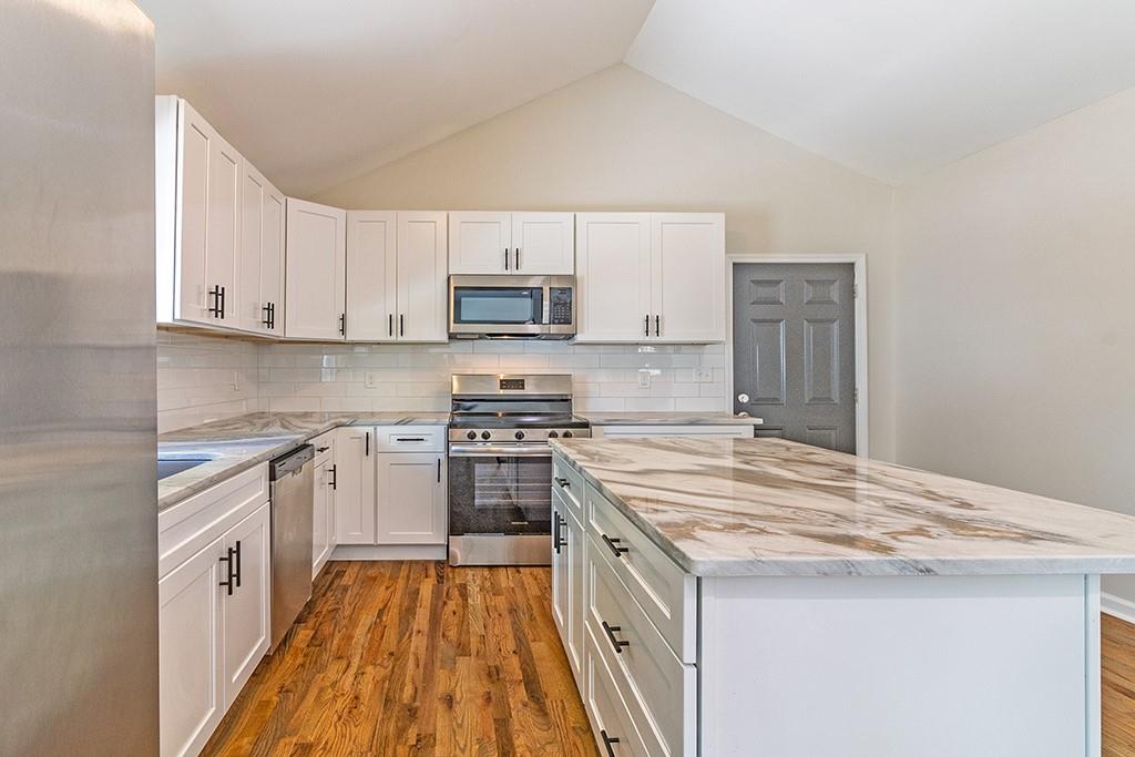 111 Ford Street Cartersville, GA 30120 - Photo 15 of 19 a kitchen with stainless steel appliances a sink stove and cabinets