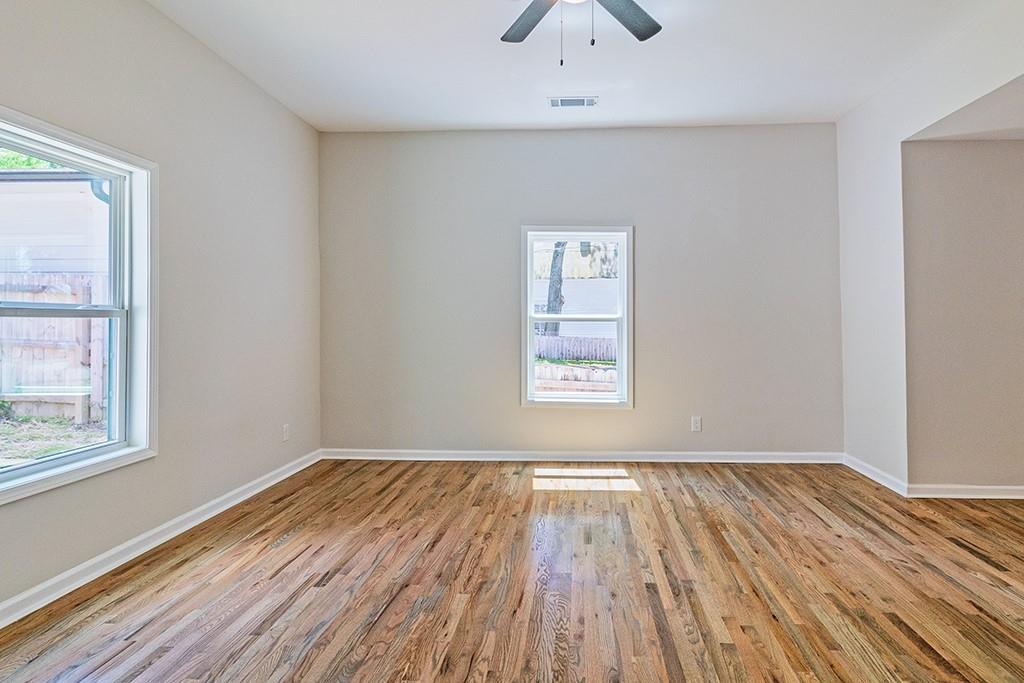 111 Ford Street Cartersville, GA 30120 - Photo 19 of 19 an empty room with wooden floor and windows