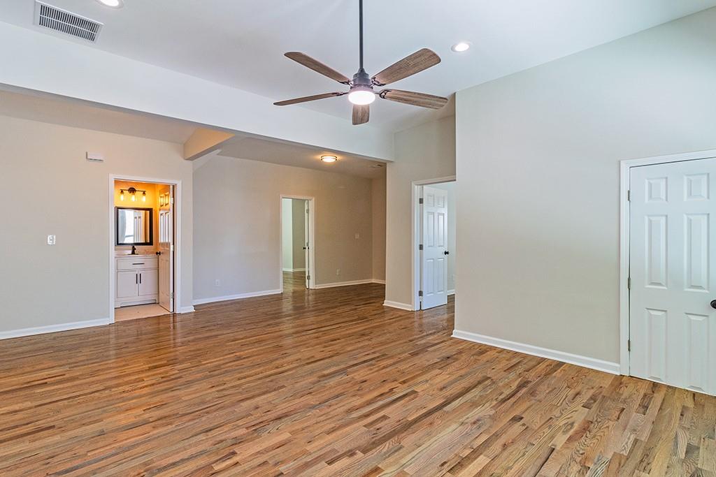 111 Ford Street Cartersville, GA 30120 - Photo 7 of 19 wooden floor in an empty room with a window