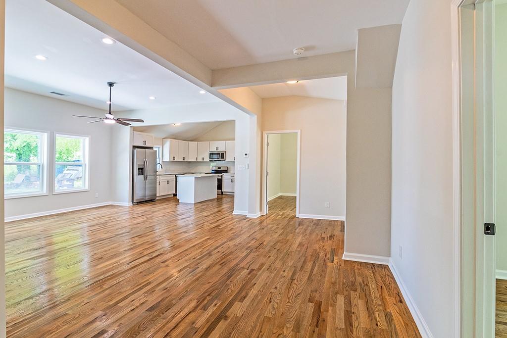 111 Ford Street Cartersville, GA 30120 - Photo 8 of 19 a view of a kitchen with wooden floor and a kitchen