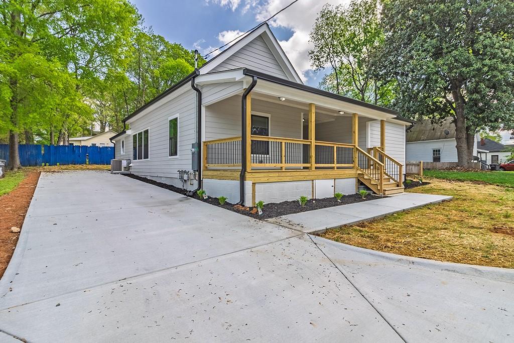 111 Ford Street Cartersville, GA 30120 - Photo 10 of 19 a view of a house with backyard and trees