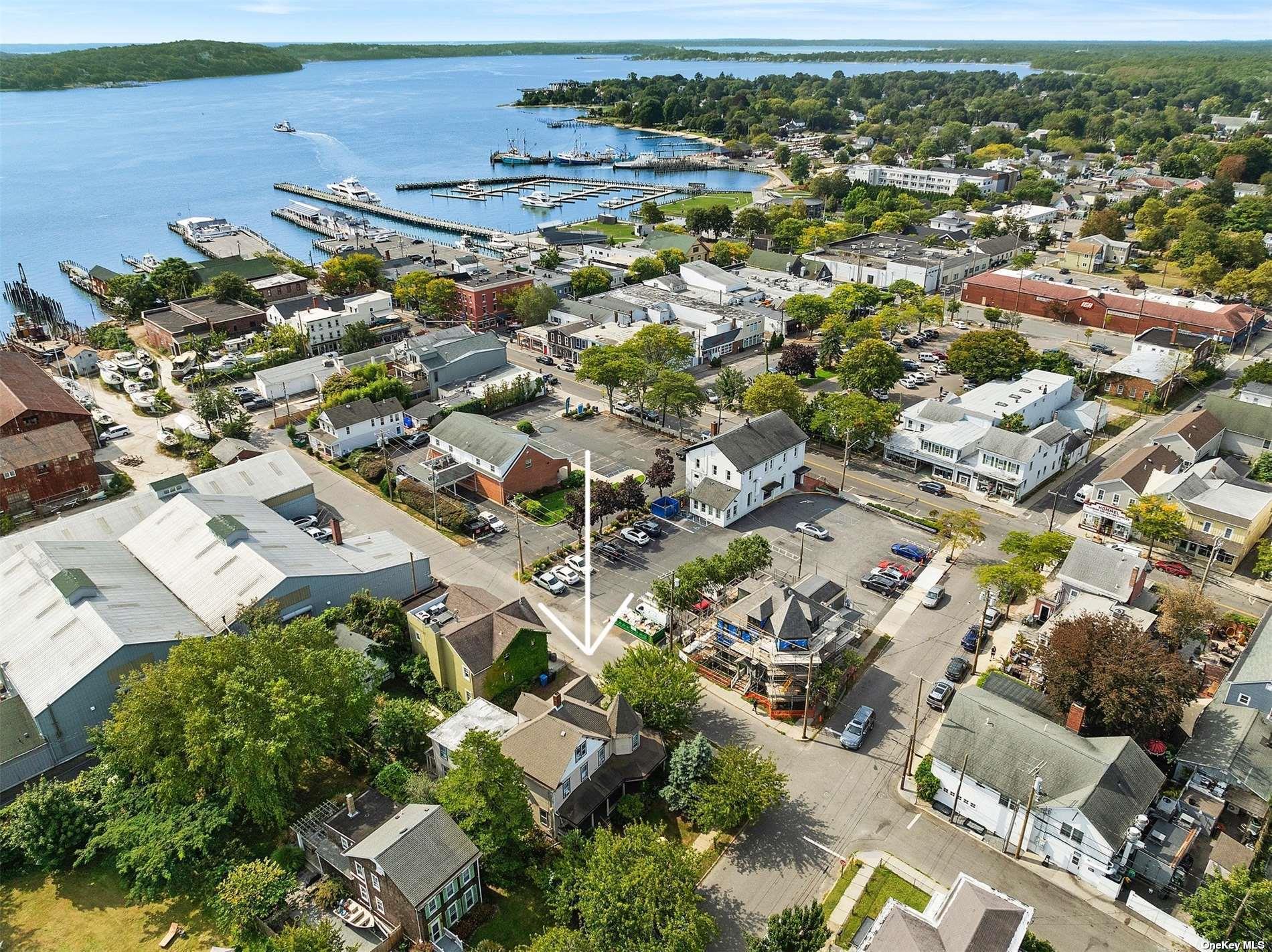 151 Bay Avenue Greenport, NY 11944 - Photo 18 of 21 an aerial view of residential building with parking