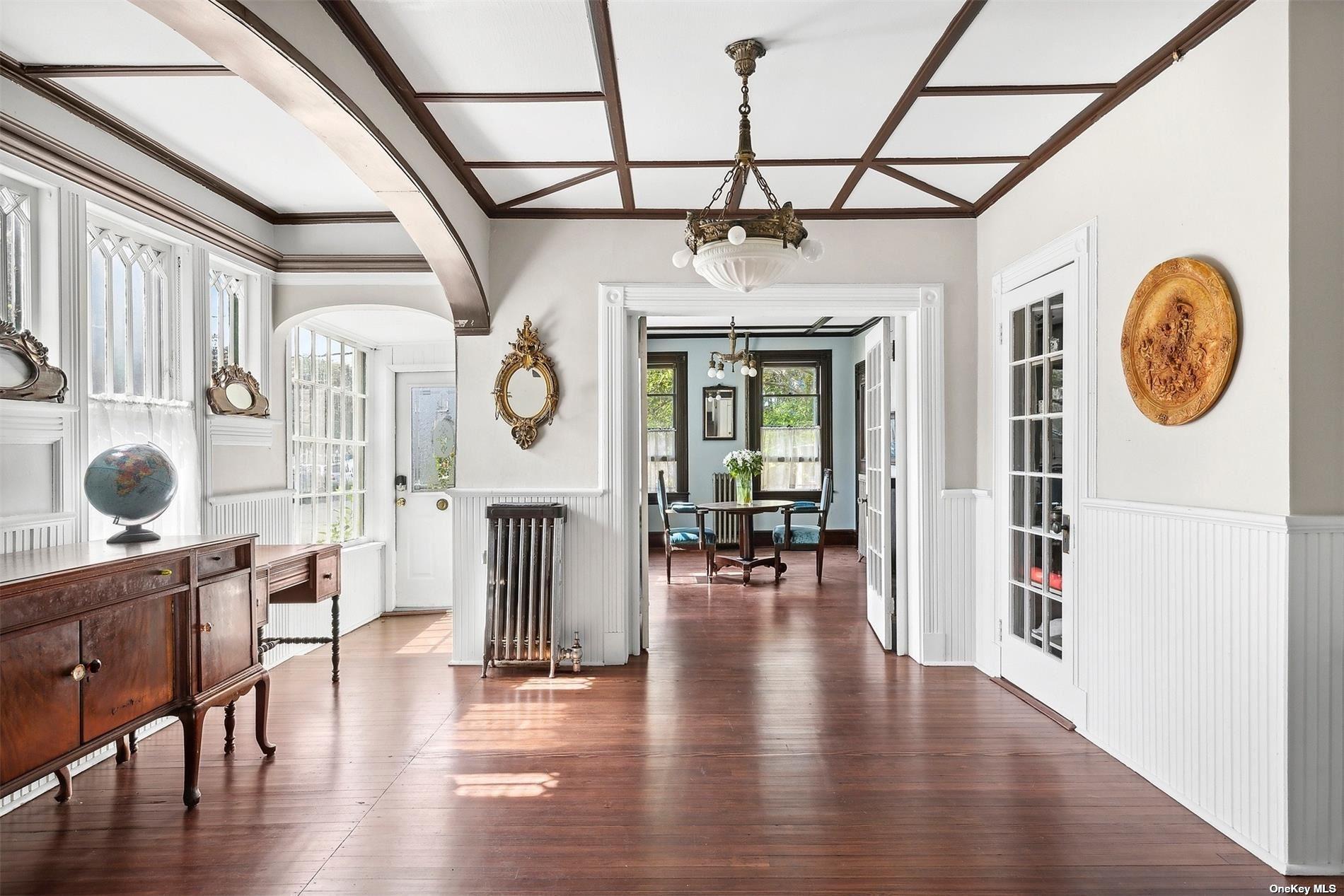 151 Bay Avenue Greenport, NY 11944 - Photo 5 of 21 a view of dining room with wooden floor and chandelier