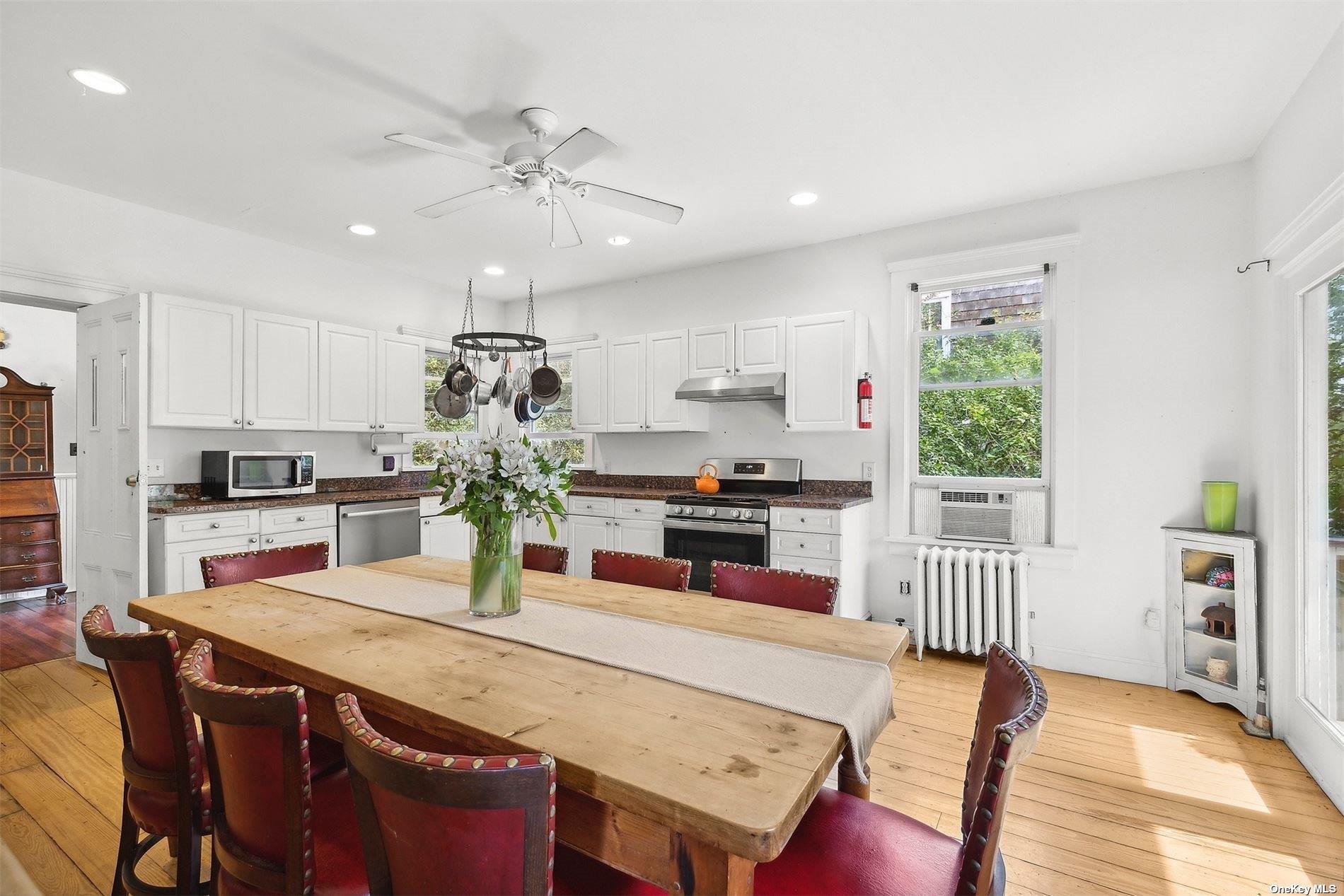 151 Bay Avenue Greenport, NY 11944 - Photo 6 of 21 a kitchen with a table and chairs in it