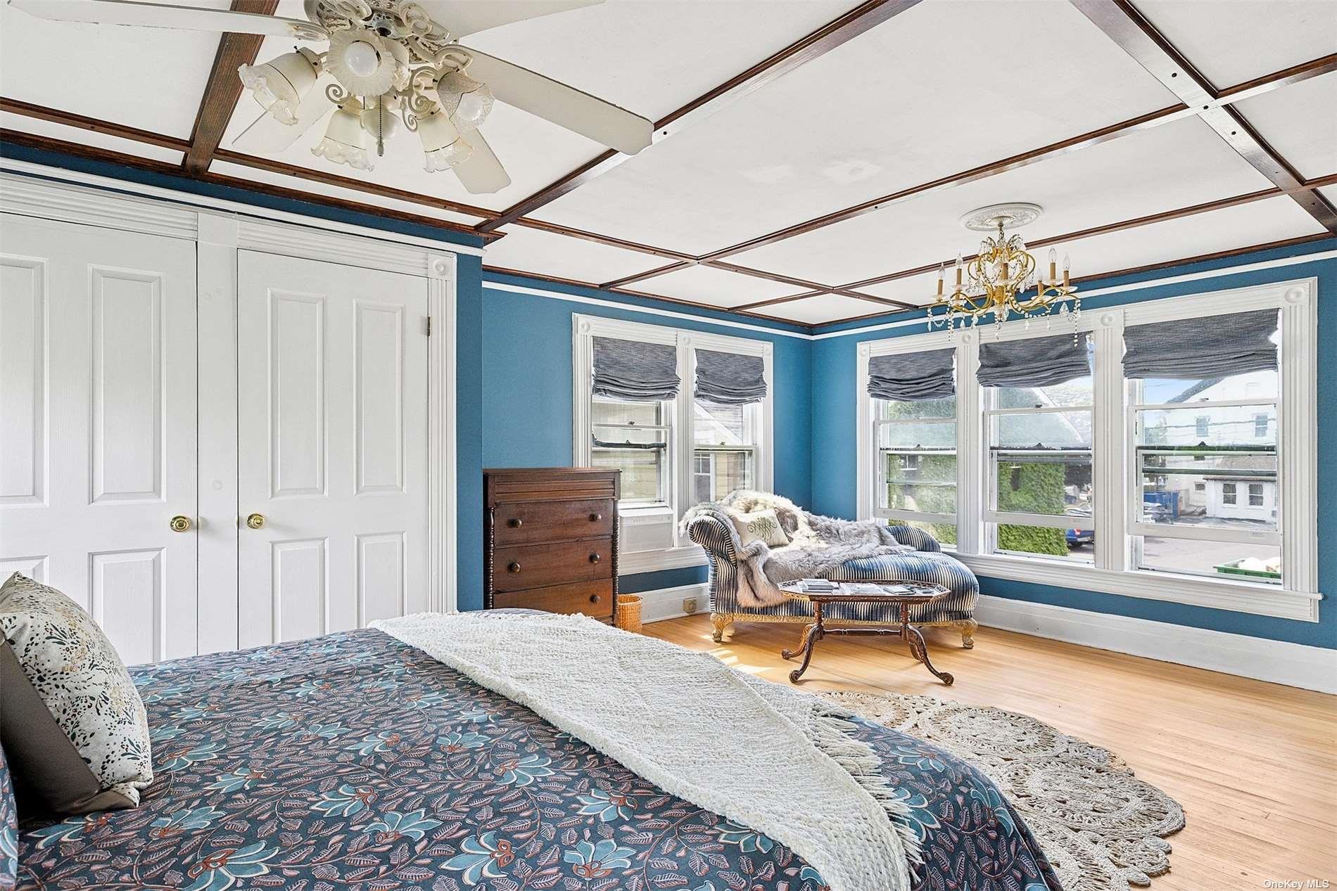 151 Bay Avenue Greenport, NY 11944 - Photo 10 of 21 a bedroom with furniture and large windows