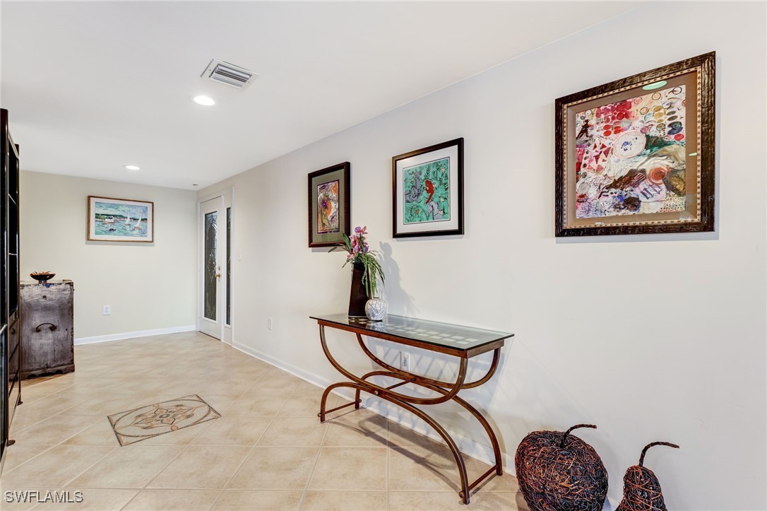 1910 Virginia Avenue, Unit 403 Fort Myers, FL 33901 - Photo 14 of 45 a view of a livingroom with furniture and a ceiling fan
